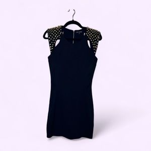 Black mini dress w/shoulder cutouts, studs & a stunning zipper down the back.